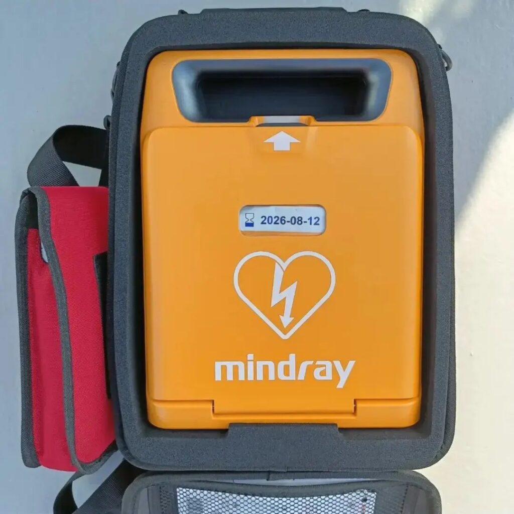 Mindray AED defibrillator inside a protective carrying case, showcasing portability and readiness for emergency use, featured in the post 'Mindray Defibrillator vs. Competitors'