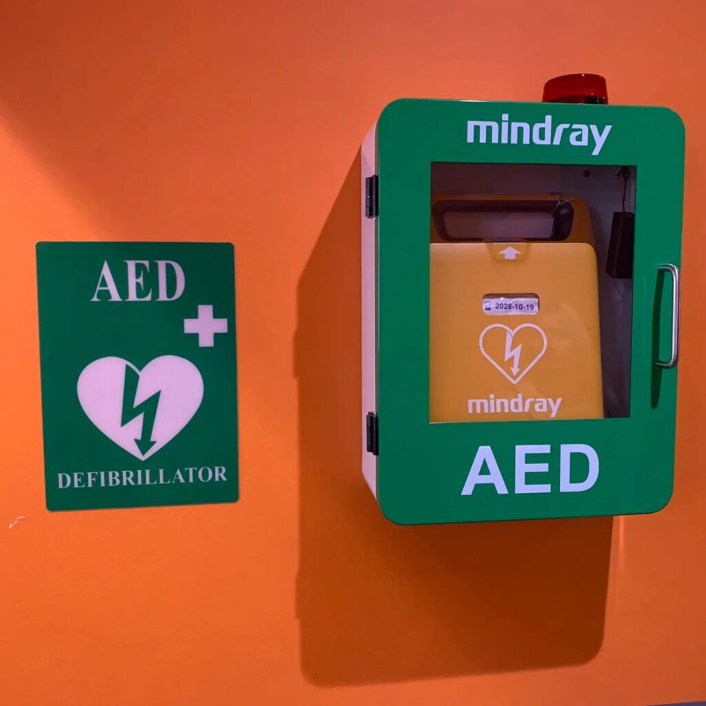 Mindray AED defibrillator in a green case, highlighting life-saving equipment for emergencies.