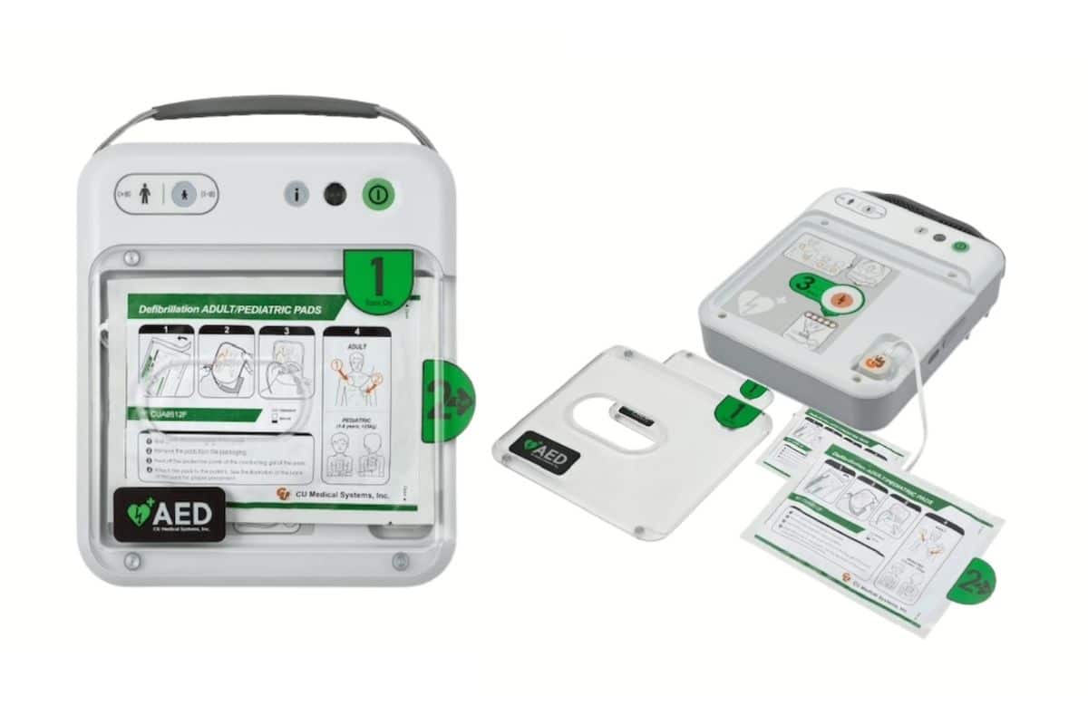 The iPAD NFK200 defibrillator with a transparent cover next to an open version showing instructions.
