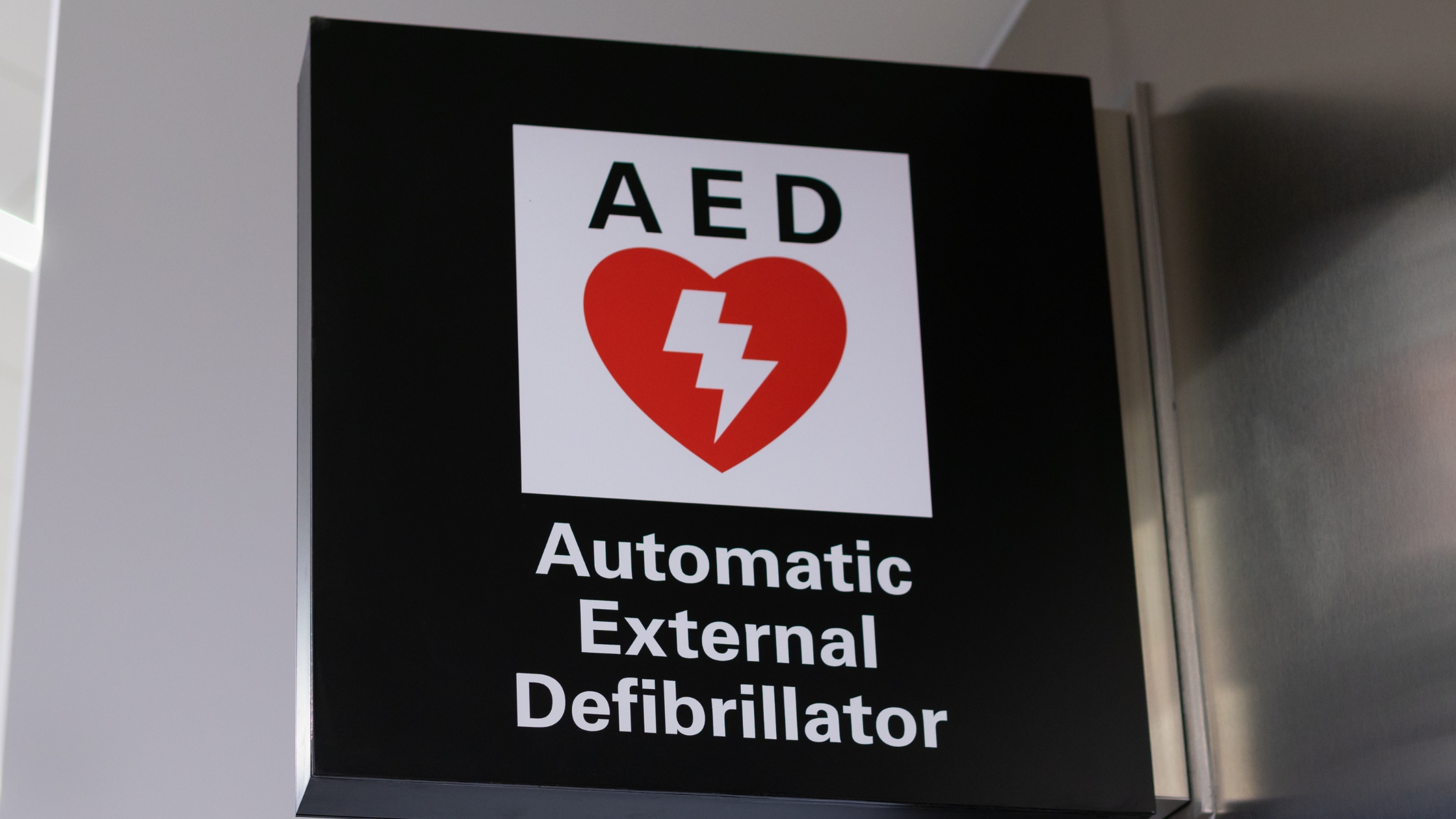AED signage for defibrillator location - Enhance workplace safety with visible AED identification