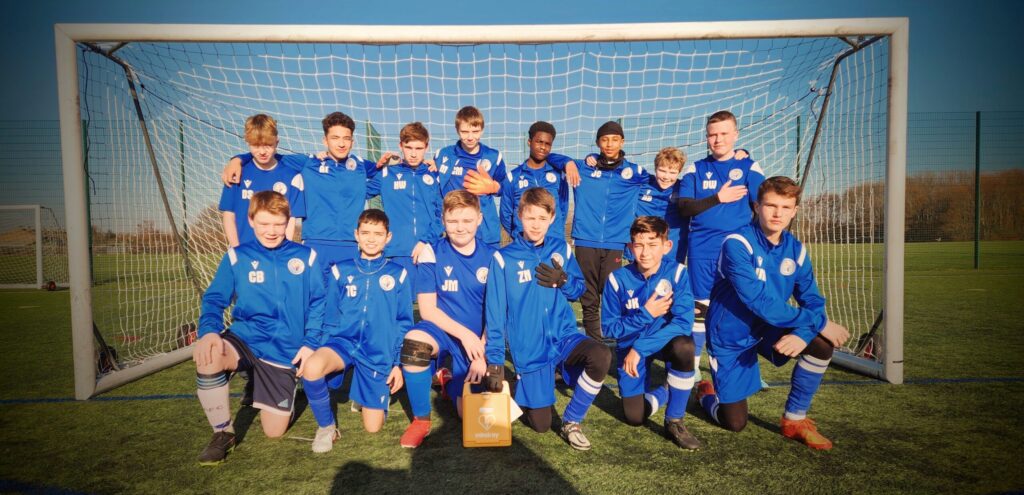 Highlights the importance of having life-saving equipment like defibrillators readily available in sports settings.