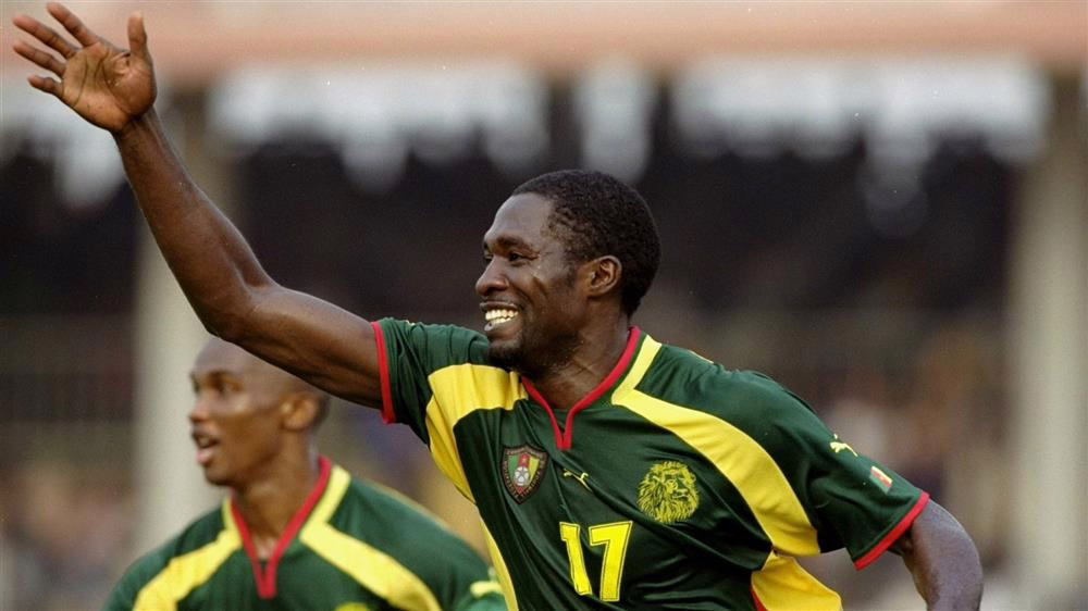 Marc-Vivien Foe with a Cameroon team mate on the field.