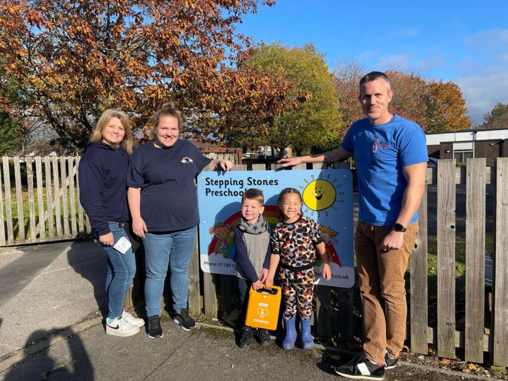 Stepping Stones Preschool staff and children with a donated Mindray AED - Promoting child-specific defibrillation for emergencies in educational settings