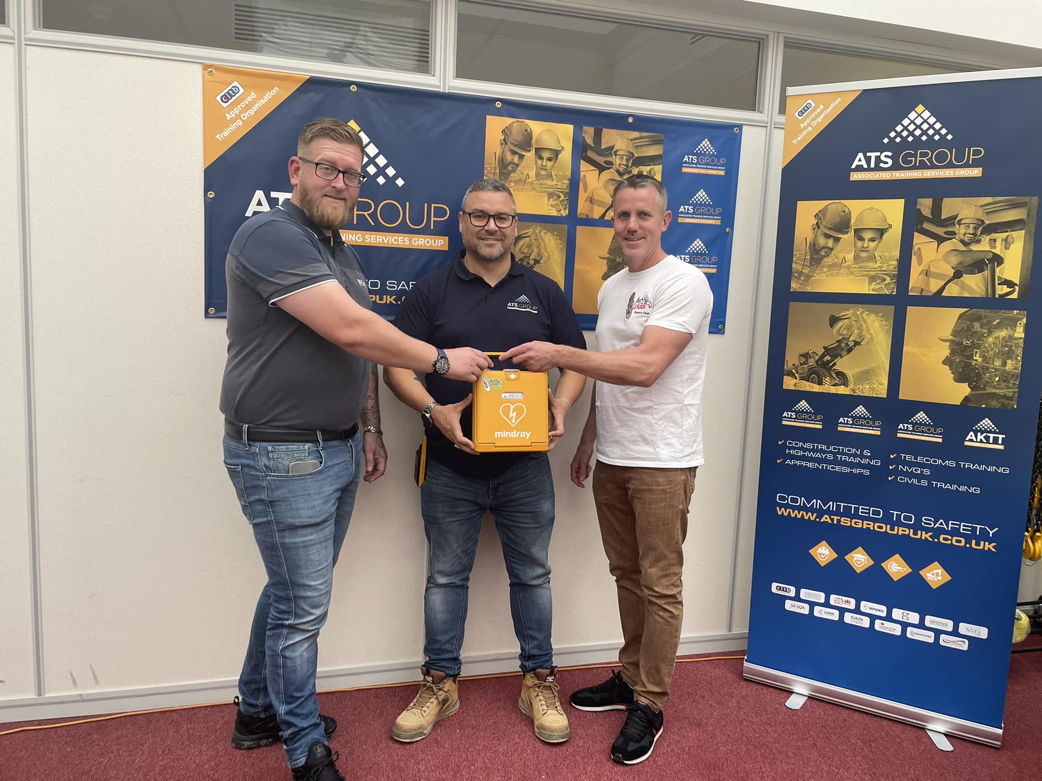 ATS Group team receiving a Mindray AED defibrillator, emphasizing the importance of cardiac emergency response plans in businesses