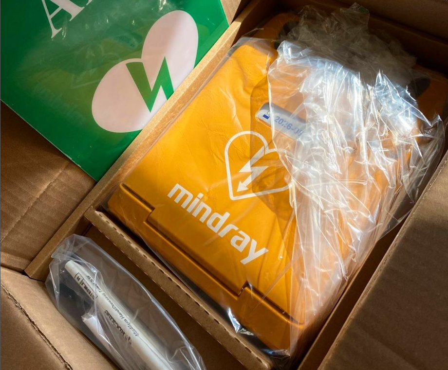 New Mindray AED defibrillator unpacked, showcasing the device and accessories, ready for deployment in emergency situations.