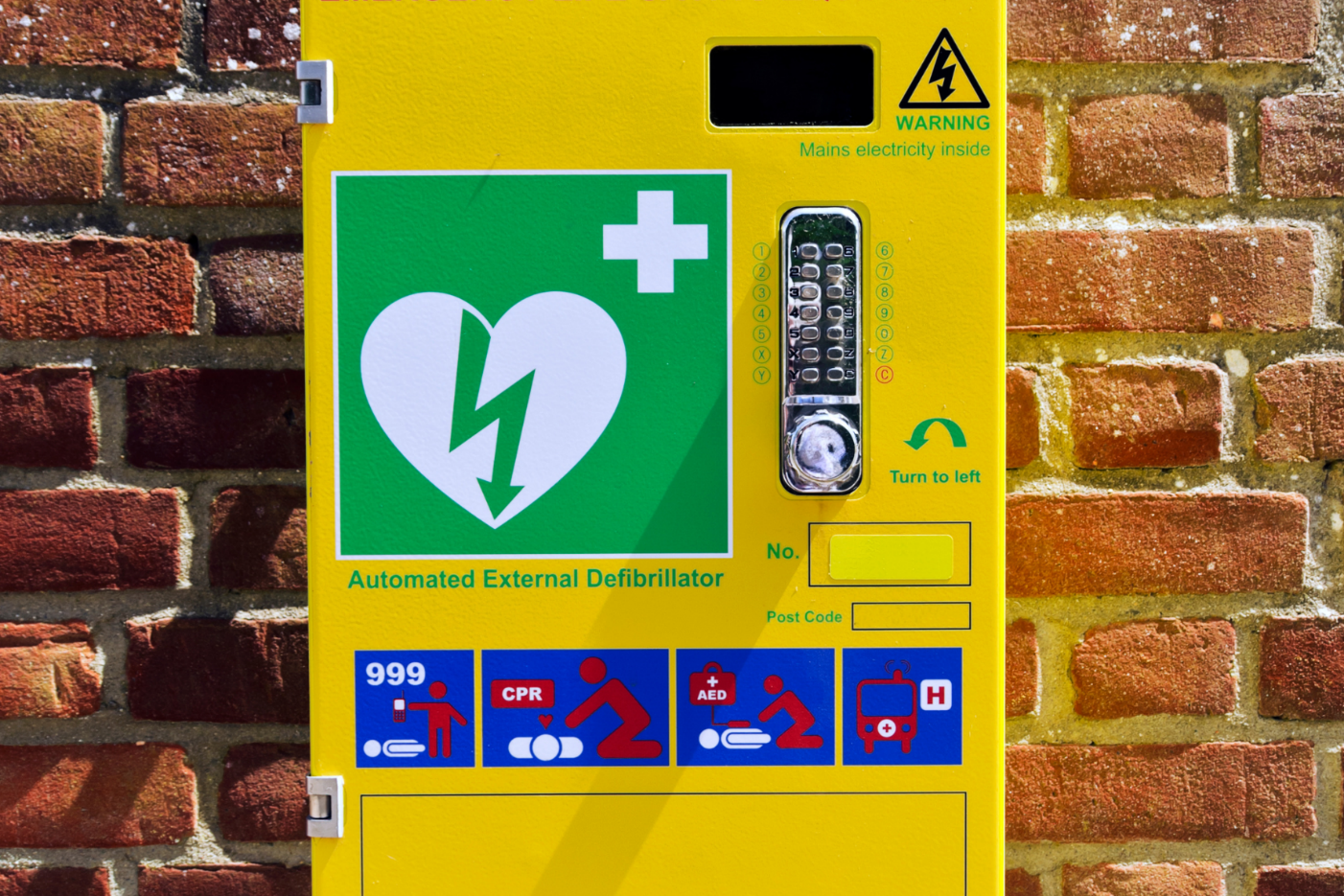 AED public access station with clear instructions, code access, and CPR guidance for emergency use.